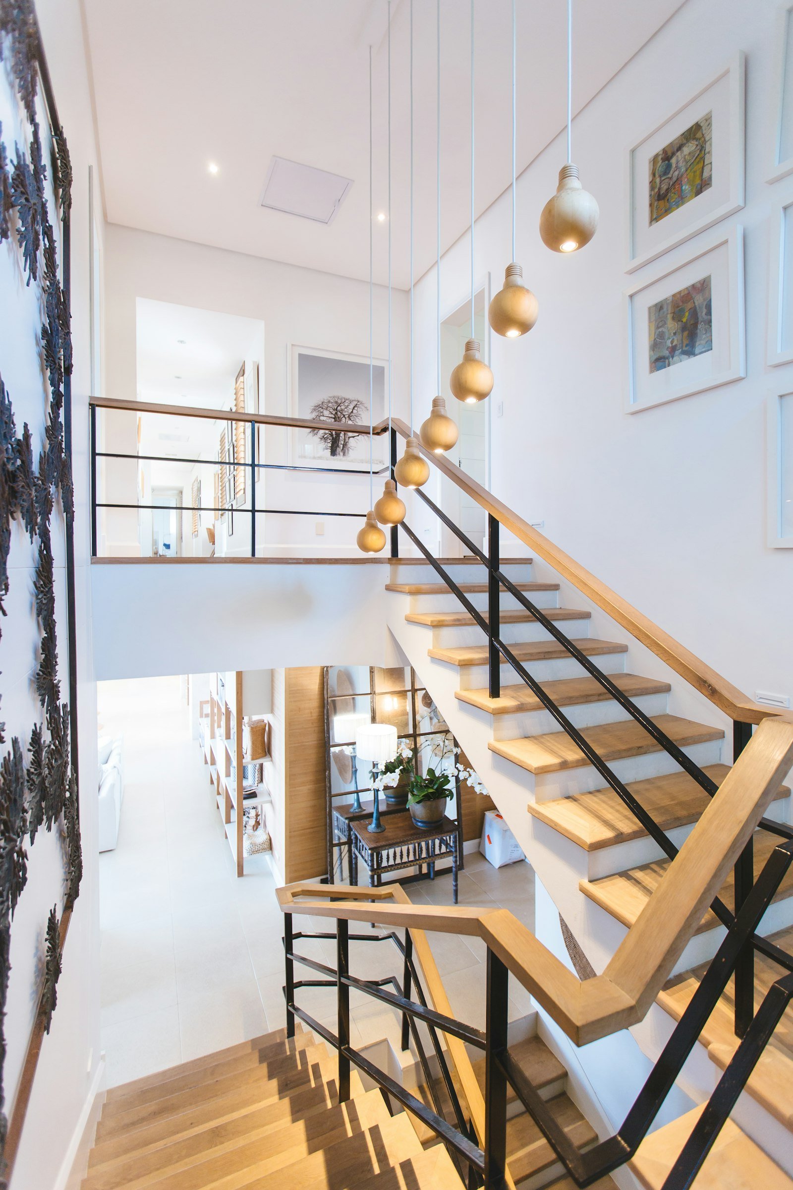 Stair hall at Casa Lumen, with an oak stair and lime-washed walls